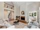 Spacious living room with hardwood floors, fireplace, and soaring ceiling leading to upstairs at 210 Wentworth Ter, Alpharetta, GA 30022