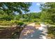 Scenic park path surrounded by lush greenery and landscaping at 210 Wentworth Ter, Alpharetta, GA 30022