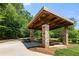 Picturesque park pavillion with stone pillars and wooden roof, perfect for gatherings at 210 Wentworth Ter, Alpharetta, GA 30022