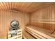The wooden sauna features built-in benches and a modern heater for relaxation at 210 Wentworth Ter, Alpharetta, GA 30022