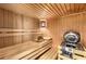 Home sauna room with benches, wood paneling, and heater at 210 Wentworth Ter, Alpharetta, GA 30022