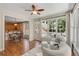 Inviting sunroom showcasing natural light, hardwood floors, and access to the breakfast nook at 210 Wentworth Ter, Alpharetta, GA 30022