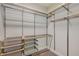 Walk-in closet with wire shelves, drawers and storage baskets at 210 Wentworth Ter, Alpharetta, GA 30022