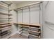Spacious walk-in closet features wire shelves and storage baskets at 210 Wentworth Ter, Alpharetta, GA 30022