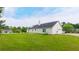 Home with solar panels, a two-car garage and a spacious yard, ideal for outdoor activities at 213 Whistle Way, Locust Grove, GA 30248