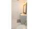 Bathroom featuring a gray vanity with a framed mirror and neutral colored floors at 213 Whistle Way, Locust Grove, GA 30248