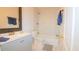 Bathroom featuring a tub, shower and modern fixtures at 213 Whistle Way, Locust Grove, GA 30248