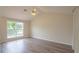 Bright bedroom featuring hardwood floors, and a ceiling fan at 213 Whistle Way, Locust Grove, GA 30248