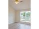 Bright bedroom featuring hardwood floors and double windows providing plenty of natural light at 213 Whistle Way, Locust Grove, GA 30248