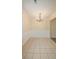 Bright dining room with wainscoting and neutral tile flooring at 213 Whistle Way, Locust Grove, GA 30248