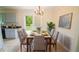 Inviting dining room featuring a table with six chairs, chandelier, decor, and a door to the outside at 213 Whistle Way, Locust Grove, GA 30248