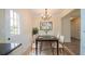 Elegant dining room featuring modern lighting and stylish furniture at 213 Whistle Way, Locust Grove, GA 30248