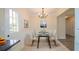 Classic dining room with chandelier lighting and elegant table setting at 213 Whistle Way, Locust Grove, GA 30248