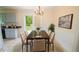 Stylish dining area adjacent to kitchen with backyard view at 213 Whistle Way, Locust Grove, GA 30248