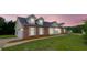 Charming two-story home with brick accents, dormer windows, and well-manicured lawn at 213 Whistle Way, Locust Grove, GA 30248