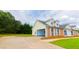 Spacious home with attached garage and well-maintained lawn, featuring charming brick accents at 213 Whistle Way, Locust Grove, GA 30248