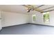 Clean, open garage with painted floor and two windows, offering ample space at 213 Whistle Way, Locust Grove, GA 30248