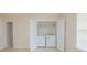 Washer and dryer with white bi-fold doors in laundry closet at 213 Whistle Way, Locust Grove, GA 30248