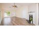 Living room with vaulted ceilings, fireplace, hardwood floors, and lots of natural light at 213 Whistle Way, Locust Grove, GA 30248