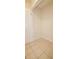 Unfurnished walk-in closet featuring tile floors, neutral walls, and a partially visible door at 213 Whistle Way, Locust Grove, GA 30248