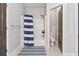 Bathroom featuring a blue and white striped shower curtain, and tile flooring at 2358 Well Springs Dr, Buford, GA 30519