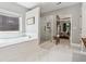 Bathroom featuring a soaking tub, separate glass-enclosed shower, and natural light at 2358 Well Springs Dr, Buford, GA 30519