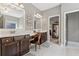 Bathroom with double sink vanity, dark wood cabinets, and large mirrors offering ample counter space at 2358 Well Springs Dr, Buford, GA 30519