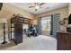 Bedroom featuring a loft bed with a desk area, ceiling fan and natural light from the window at 2358 Well Springs Dr, Buford, GA 30519