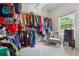 Walk-in closet featuring shelving and hanging storage for organized clothing and accessories at 2358 Well Springs Dr, Buford, GA 30519