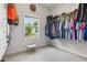 Bright walk-in closet featuring natural light and ample storage space for clothing and accessories at 2358 Well Springs Dr, Buford, GA 30519