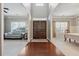 Spacious foyer leading to the dining room and living room, showcasing hardwood floors and natural light at 2358 Well Springs Dr, Buford, GA 30519