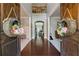 Inviting foyer with hardwood floors, views of the living spaces, and charming decorative accents at 2358 Well Springs Dr, Buford, GA 30519
