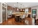 Gourmet kitchen features stainless steel appliances, dark cabinetry, and a central island at 2358 Well Springs Dr, Buford, GA 30519