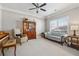 Comfortable living room featuring a piano, large window, and stylish furnishings at 2358 Well Springs Dr, Buford, GA 30519
