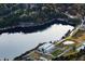 Aerial view of a serene lake and modern building nestled within a lush, green landscape at 2719 Stream Valley Lane Nw Nw Cir, Atlanta, GA 30318