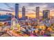 Panoramic downtown view with buildings, ferris wheel, and clear skies at 2719 Stream Valley Lane Nw Nw Cir, Atlanta, GA 30318