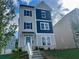 Charming two-story home featuring a blue front door, gray siding, and dark blue accents at 2719 Stream Valley Lane Nw Nw Cir, Atlanta, GA 30318