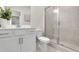 Bathroom boasts a glass enclosed shower, sleek vanity, and calming paint at 3198 Shirecrest Ln, Dacula, GA 30019