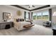 Primary bedroom boasts ample natural light, a ceiling fan, and tray ceiling at 3198 Shirecrest Ln, Dacula, GA 30019