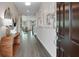 Bright foyer featuring wood-look floors, stylish console table, and decorative artwork at 3198 Shirecrest Ln, Dacula, GA 30019