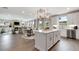 Spacious open floor plan with eat-in kitchen, island, stainless appliances, dining, and living areas at 3198 Shirecrest Ln, Dacula, GA 30019