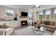 Inviting living room features a fireplace, large windows, and stylish decor at 3198 Shirecrest Ln, Dacula, GA 30019