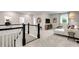 Loft area with plush carpeting, a staircase, and ample seating at 3198 Shirecrest Ln, Dacula, GA 30019