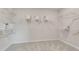 A large walk-in closet with built in shelving and metal rods for storage at 3198 Shirecrest Ln, Dacula, GA 30019