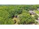 Expansive aerial view of a wooded residential area featuring well-manicured lawns and beautiful single-Gathering homes at 3235 Munsey Ct, Cumming, GA 30041