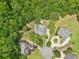 Aerial view of the property showcases the home's location surrounded by lush greenery at 3235 Munsey Ct, Cumming, GA 30041