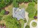 Aerial view of the home showing a patio area and landscaped yard at 3235 Munsey Ct, Cumming, GA 30041