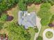 Aerial view of the home features a well-maintained roof, back deck, and landscaped yard at 3235 Munsey Ct, Cumming, GA 30041
