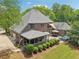 Aerial view of the home with lush trees surrounding at 3235 Munsey Ct, Cumming, GA 30041