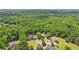 Lush green neighborhood with mature trees, well-manicured lawns and cul-de-sac at 3235 Munsey Ct, Cumming, GA 30041